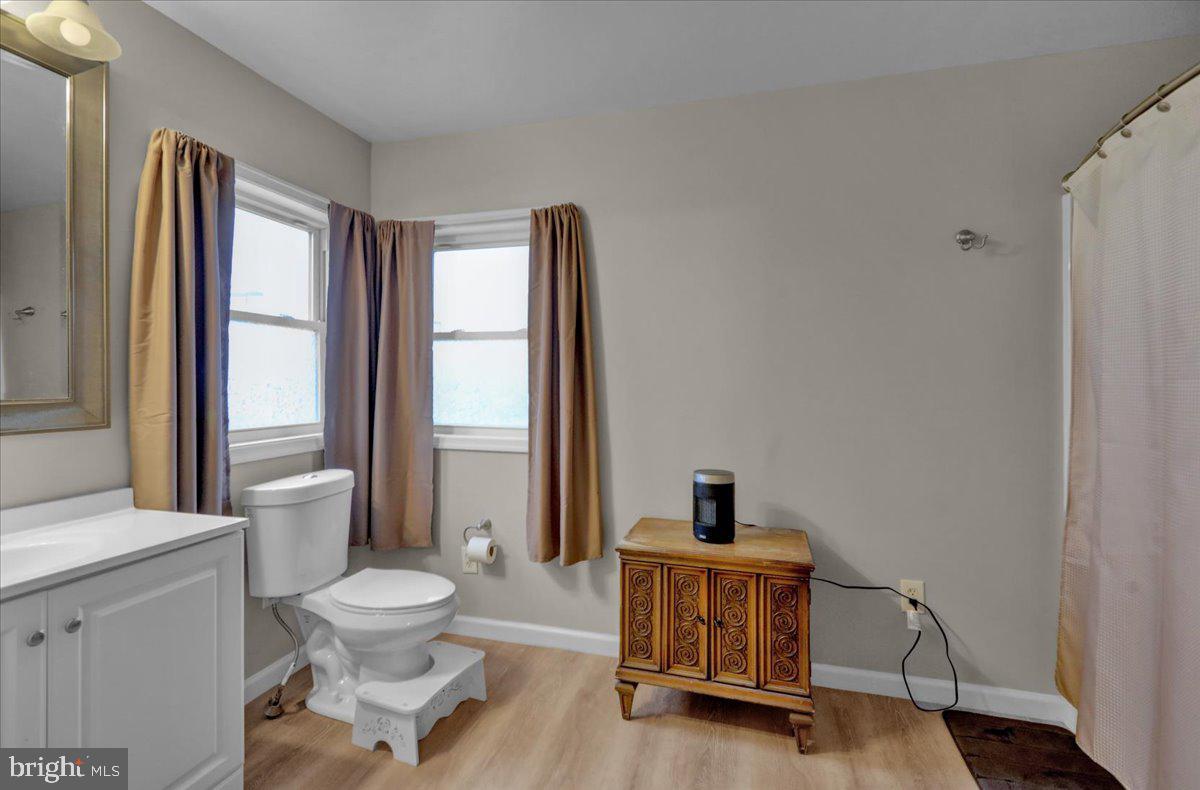 12 Trimble Boulevard Brookhaven, PA 19015 - Photo 27 of 34 a living room with furniture a window and a flat screen tv