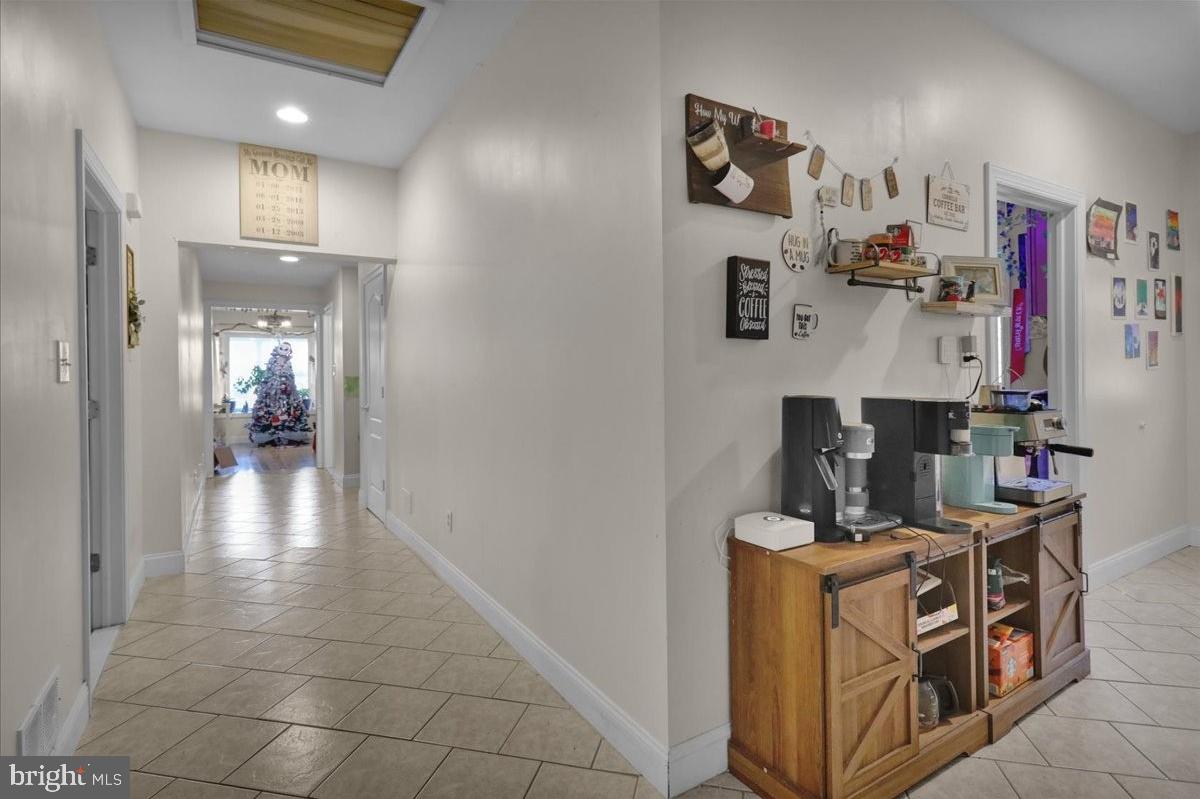 12 Trimble Boulevard Brookhaven, PA 19015 - Photo 4 of 34 a view of a hallway with workspace and a window