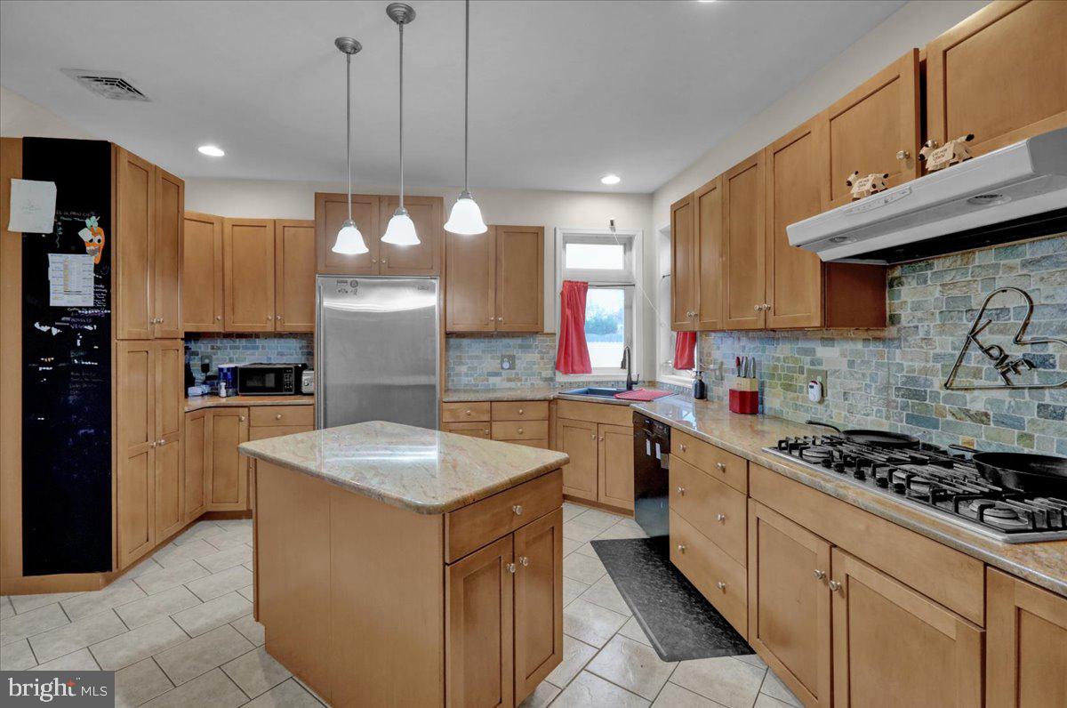 12 Trimble Boulevard Brookhaven, PA 19015 - Photo 8 of 34 a kitchen with a sink stove and cabinets