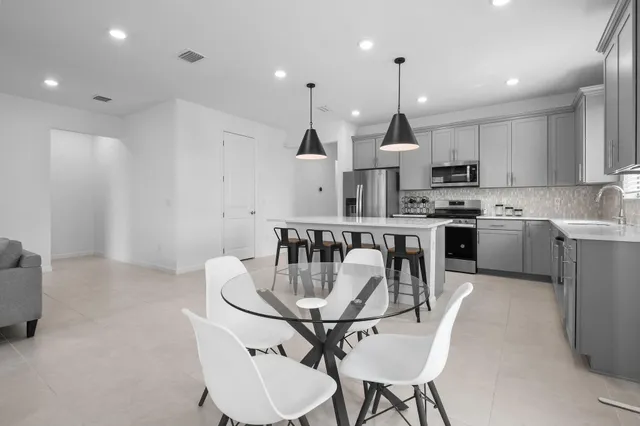 a bedroom with a bed and a lamp