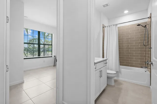 a bedroom with a bed and cabinet