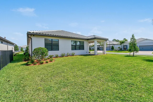 an aerial view of a houses with a swimming pool