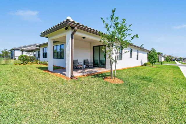 an aerial view of a house with a swimming pool