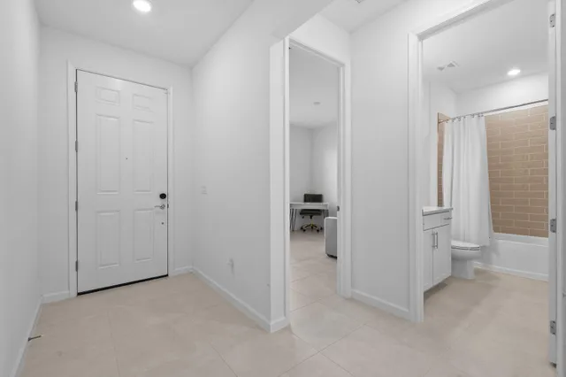 a kitchen with a sink stove and refrigerator
