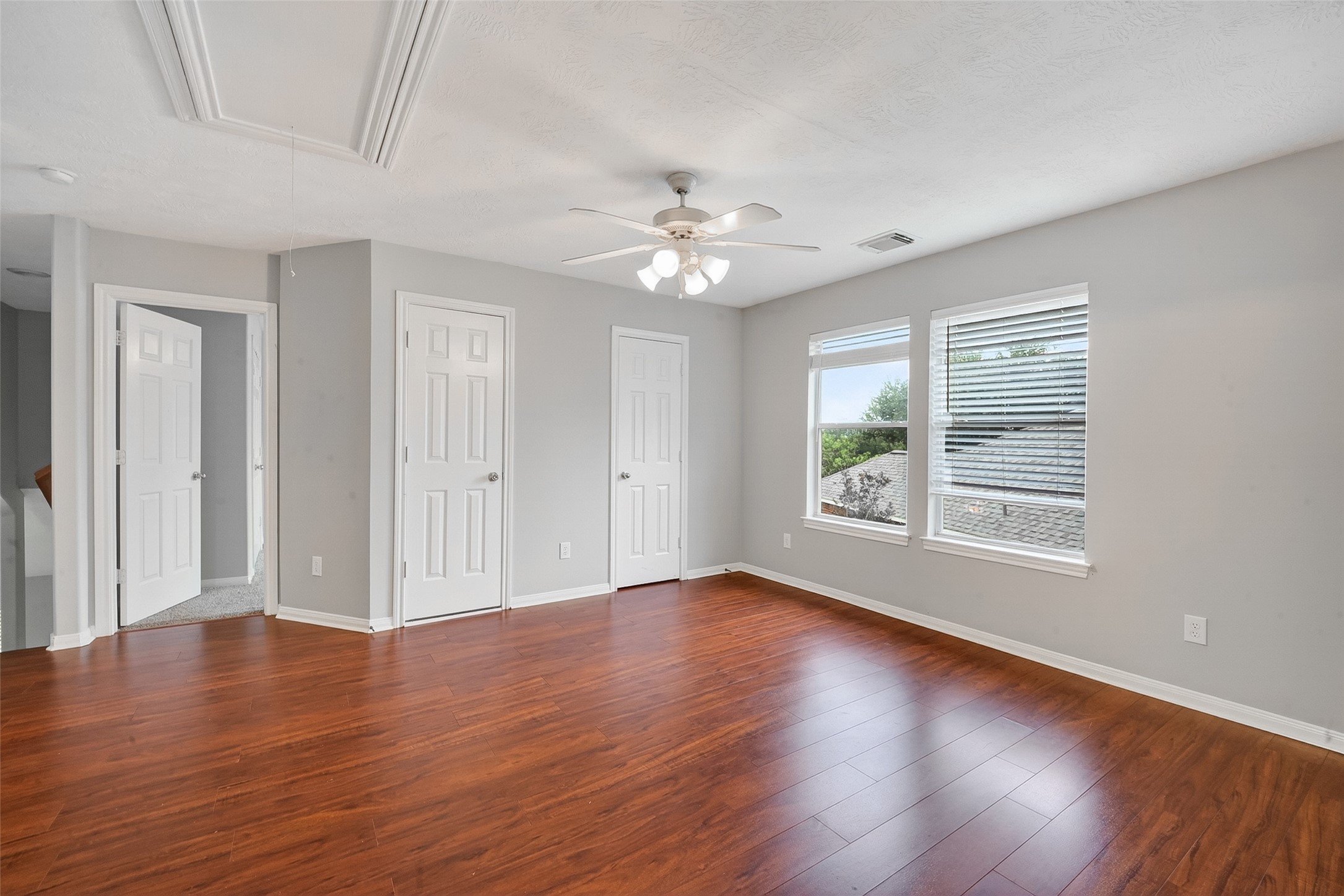 14308 Rocky Briar Lane Rosharon, TX 77583 - Photo 25 of 46 a view of an empty room with wooden floor and a window