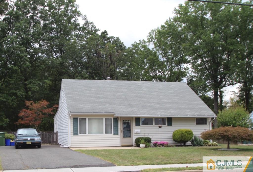 21 Sturgis Road Edison, NJ 08817 - Photo 1 of 18 a house that has a tree in front of it