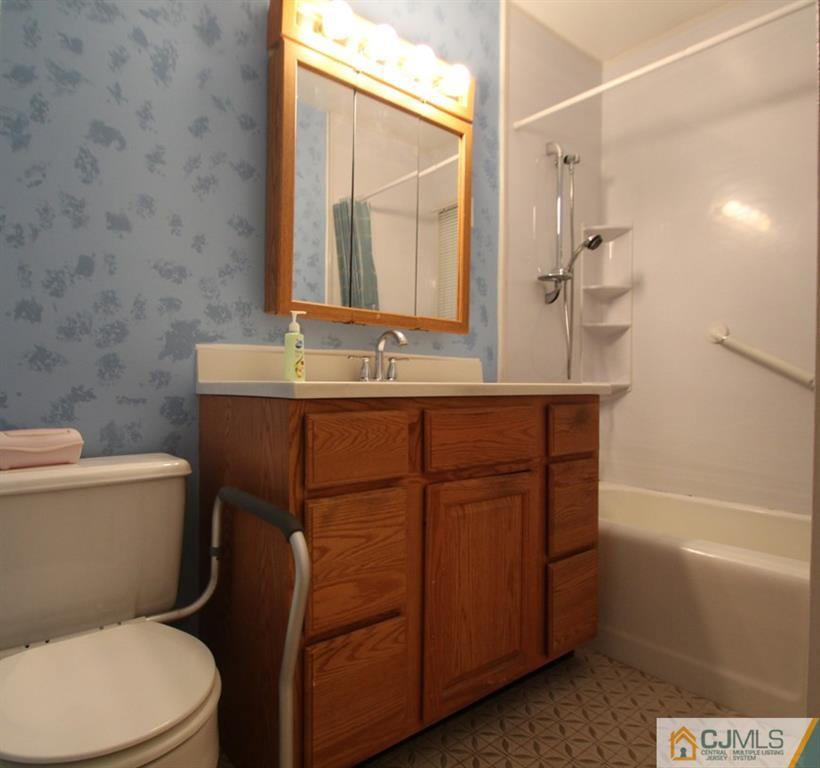 21 Sturgis Road Edison, NJ 08817 - Photo 2 of 18 a bathroom with a sink a toilet and shower