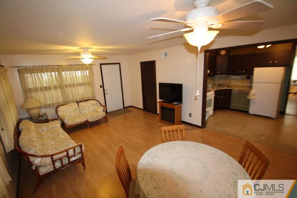 21 Sturgis Road Edison, NJ 08817 - Photo 11 of 18 a bedroom with furniture and a chandelier