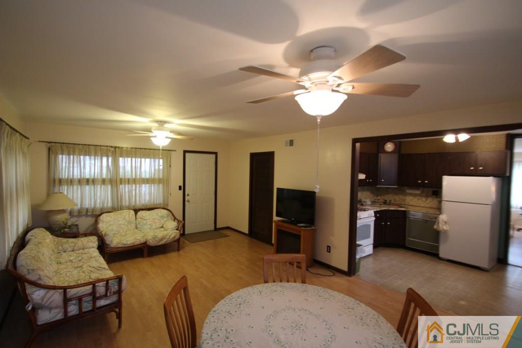 21 Sturgis Road Edison, NJ 08817 - Photo 12 of 18 a living room with furniture and a flat screen tv