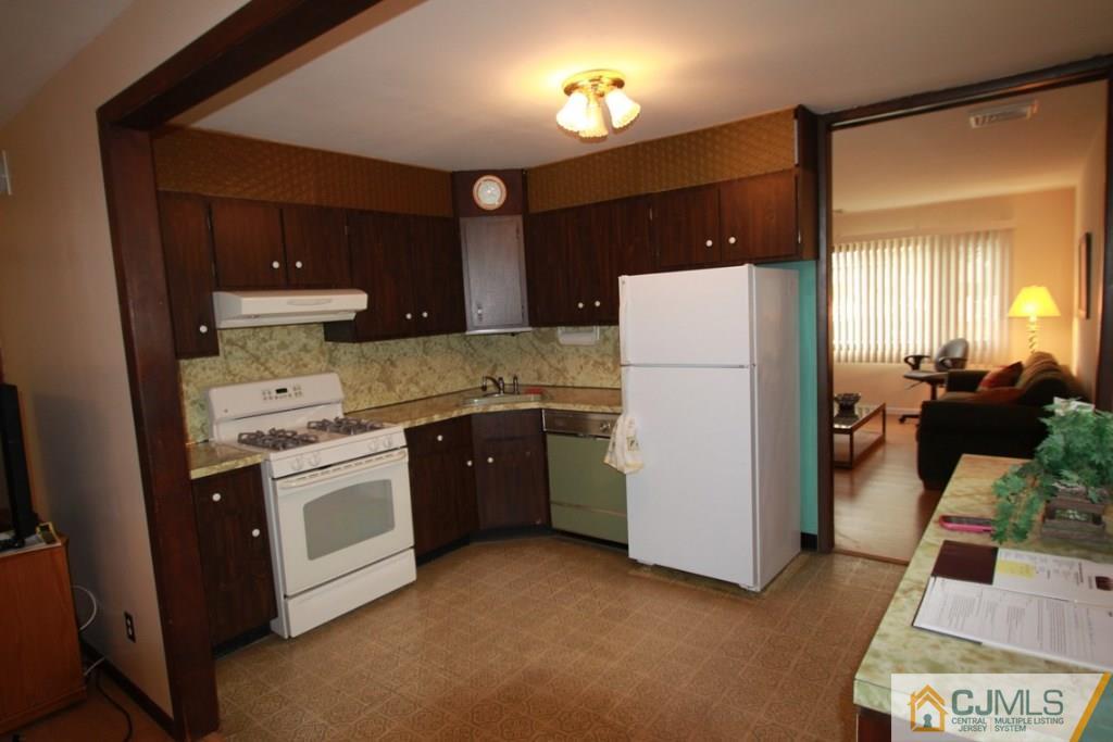 21 Sturgis Road Edison, NJ 08817 - Photo 13 of 18 a kitchen with a refrigerator sink and stove