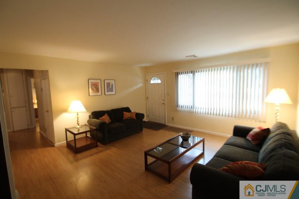21 Sturgis Road Edison, NJ 08817 - Photo 14 of 18 a living room with furniture and a window