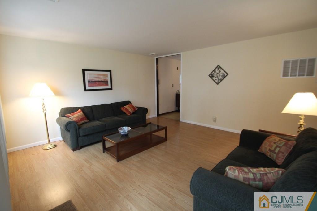 21 Sturgis Road Edison, NJ 08817 - Photo 15 of 18 a living room with furniture and a couch
