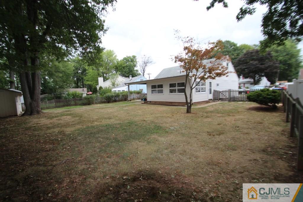 21 Sturgis Road Edison, NJ 08817 - Photo 16 of 18 a view of a outdoor space with trees