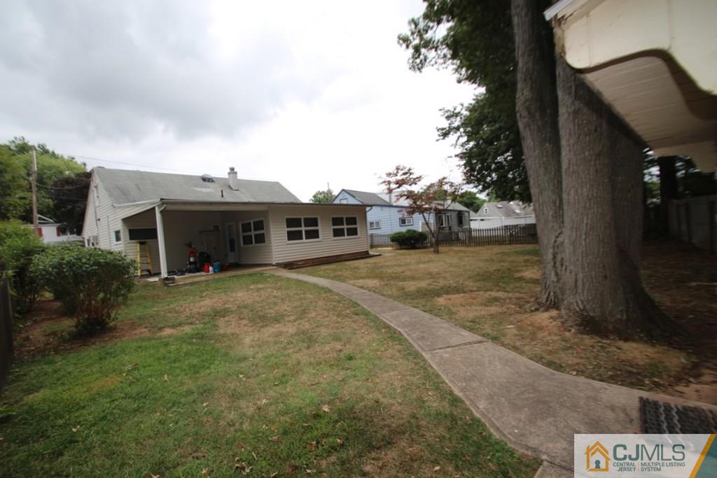21 Sturgis Road Edison, NJ 08817 - Photo 18 of 18 a view of a house with a yard and garage
