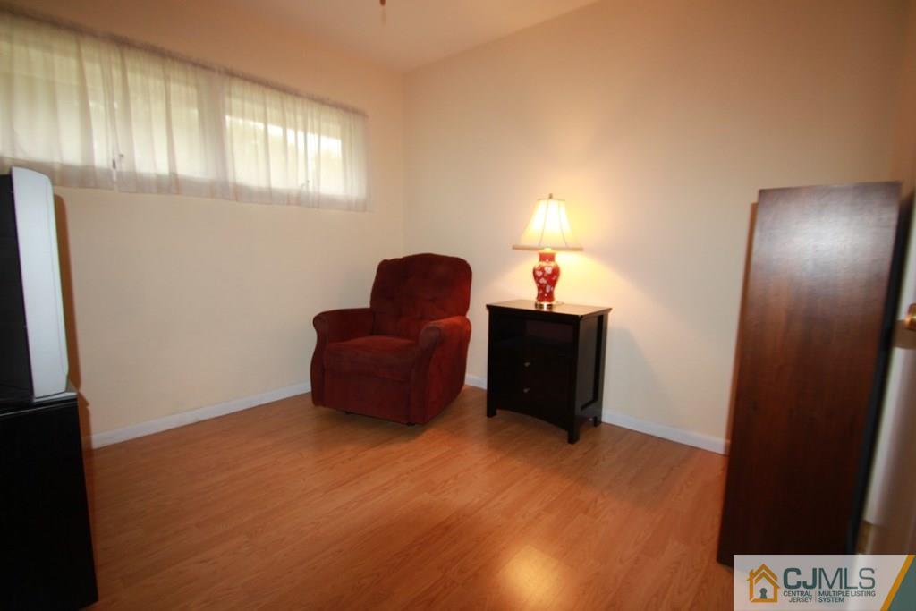 21 Sturgis Road Edison, NJ 08817 - Photo 3 of 18 a room with furniture and a window