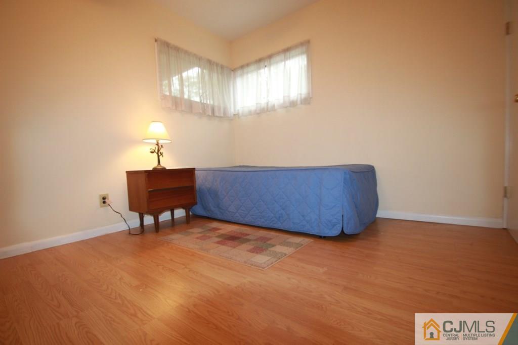 21 Sturgis Road Edison, NJ 08817 - Photo 4 of 18 a view of an empty room with a window