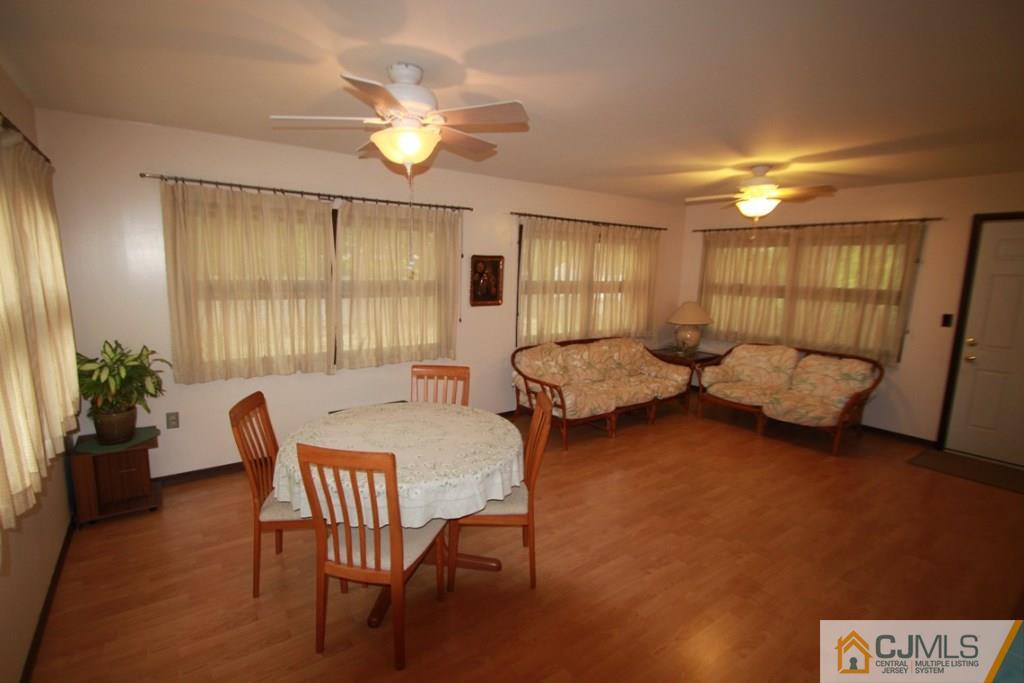 21 Sturgis Road Edison, NJ 08817 - Photo 8 of 18 a living room with furniture and a chandelier