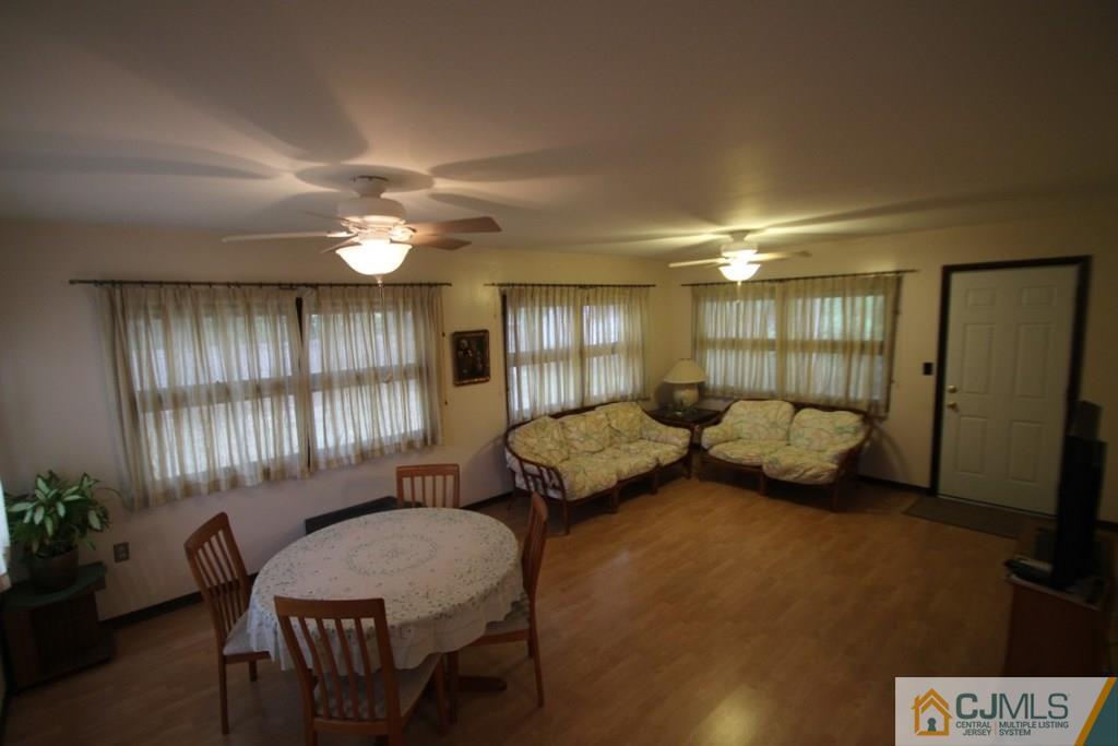 21 Sturgis Road Edison, NJ 08817 - Photo 9 of 18 a bedroom with furniture and a chandelier
