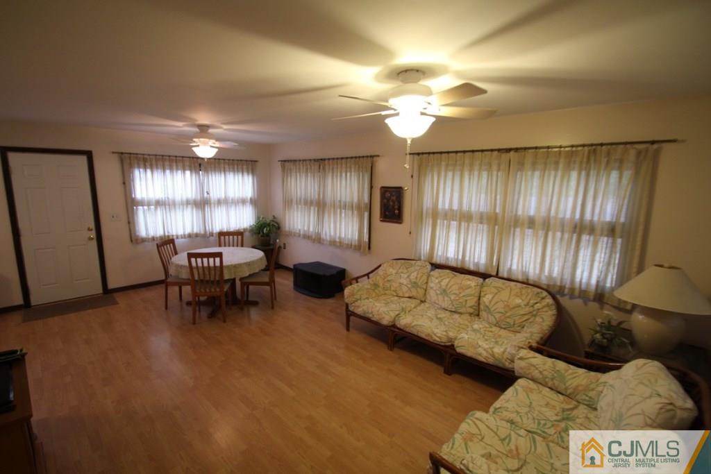 21 Sturgis Road Edison, NJ 08817 - Photo 10 of 18 a living room with furniture and a large window