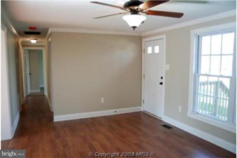 1243 Ridge Road Lusby, MD 20657 - Photo 4 of 7 Living room looking down hall...