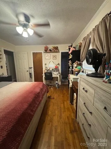 a bed room with a bed and a chair