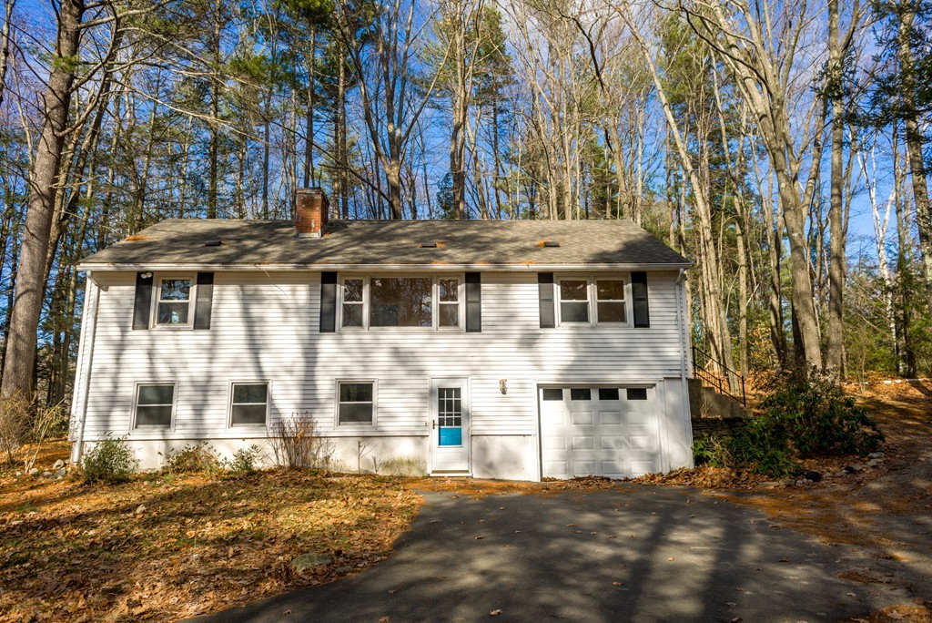 4 Harkness Road Pelham, MA 01002 - Photo 1 of 29 a view of a white house with a large tree