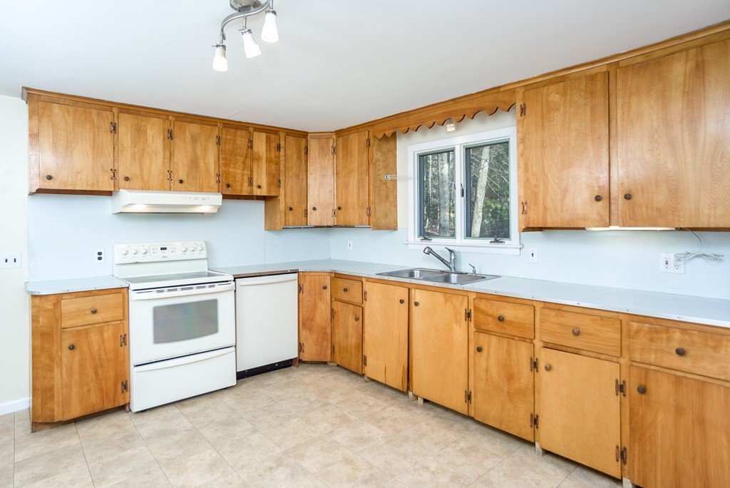 4 Harkness Road Pelham, MA 01002 - Photo 3 of 29 a kitchen with granite countertop cabinets stainless steel appliances a sink and a window
