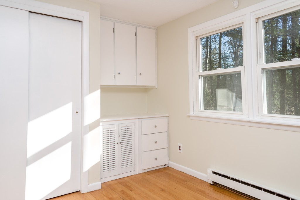 4 Harkness Road Pelham, MA 01002 - Photo 8 of 29 a view of a kitchen with wooden floor and cabinet