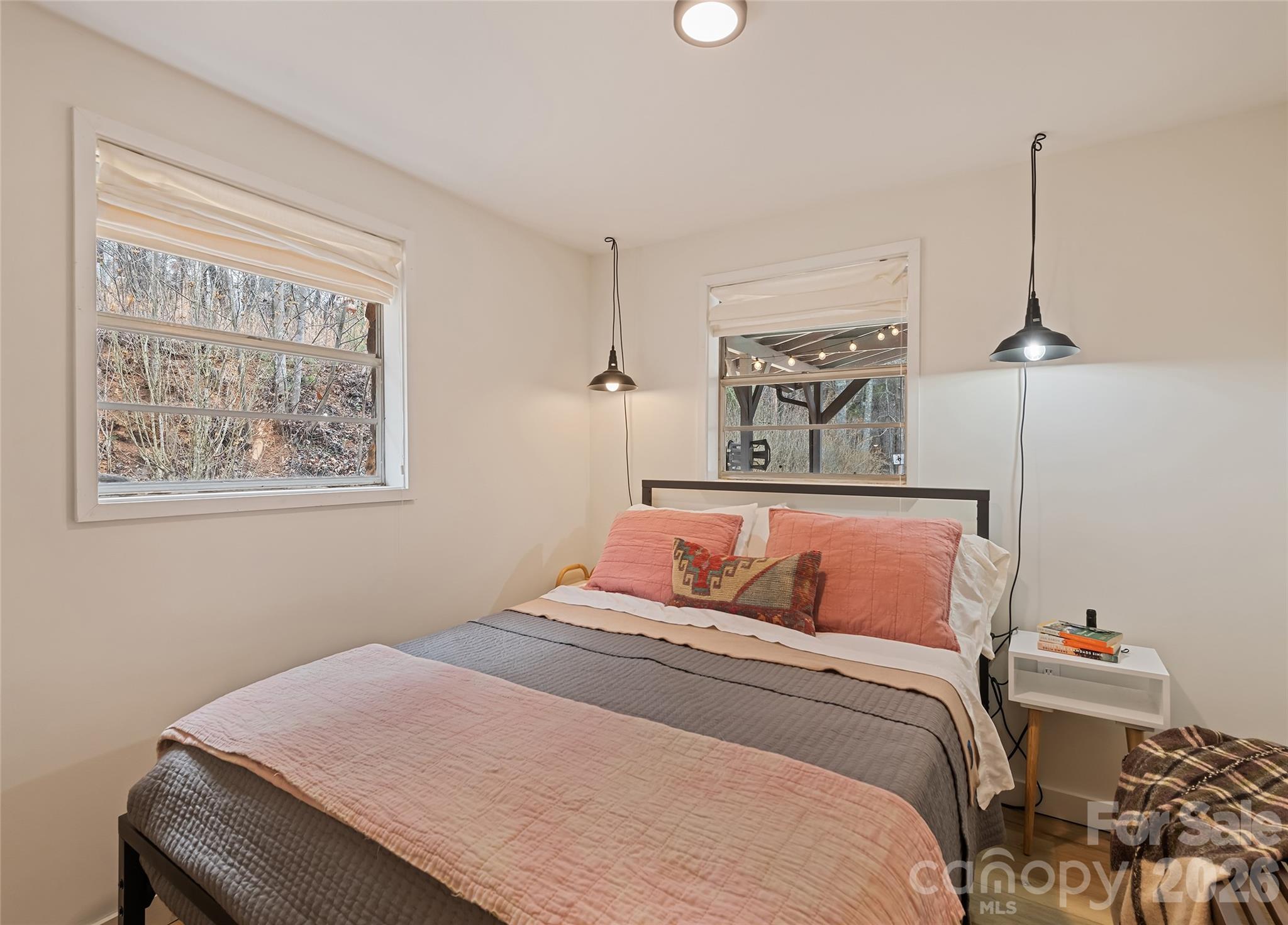 171 Fortner Road Bryson City, NC 28713 - Photo 13 of 32 a bedroom with a bed and a painting on the wall