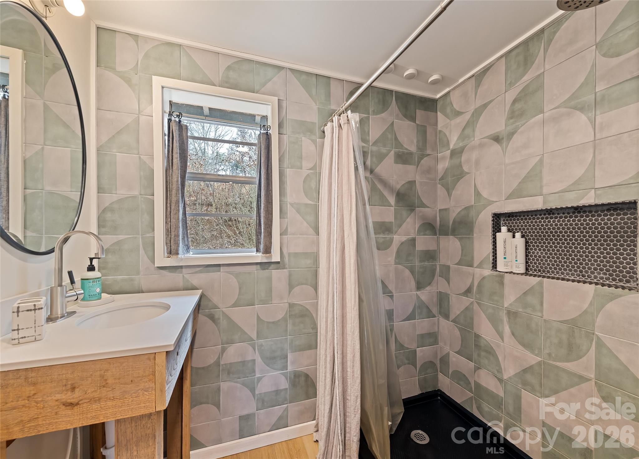 171 Fortner Road Bryson City, NC 28713 - Photo 15 of 32 a bathroom with a sink and a mirror