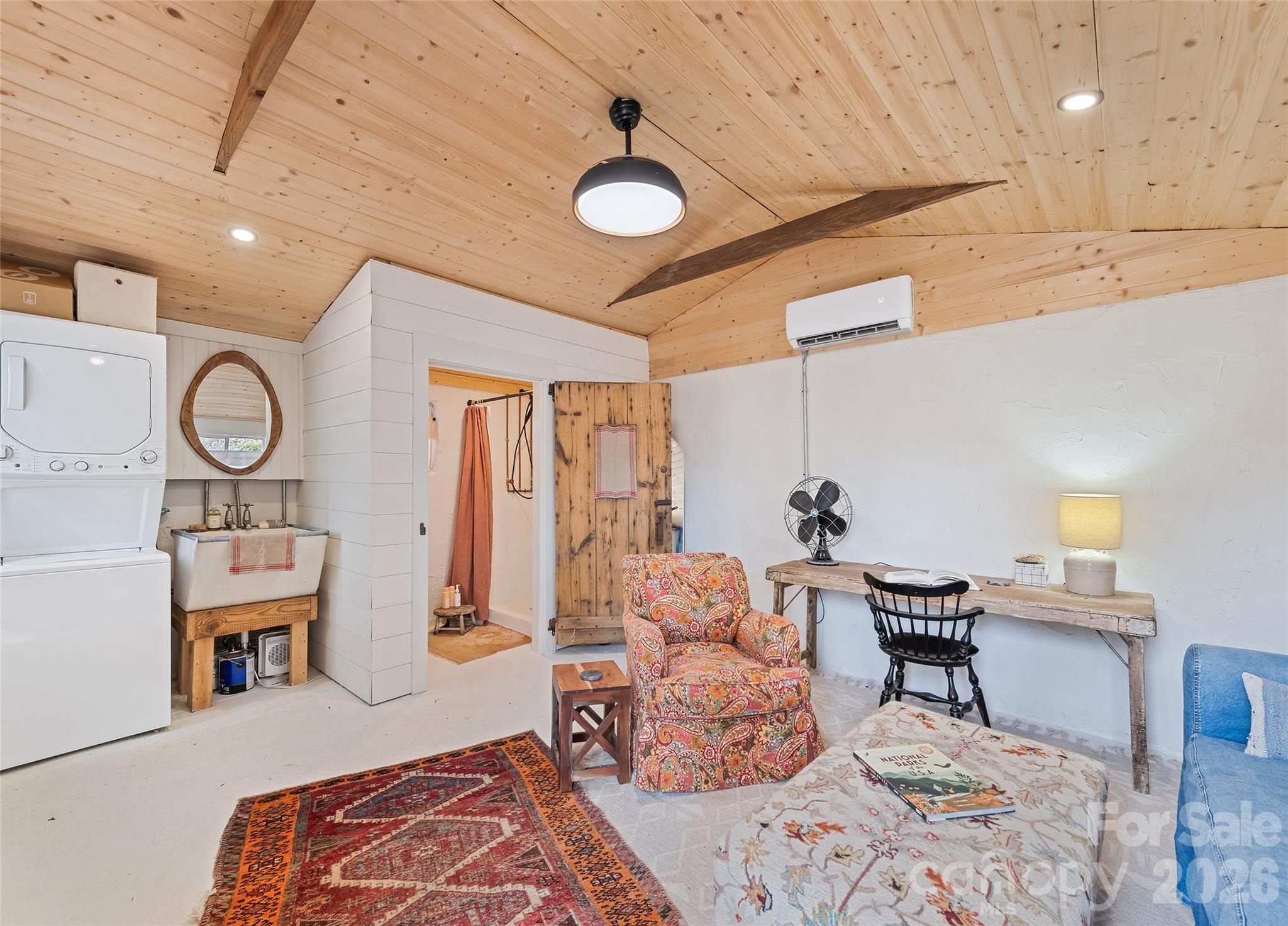 171 Fortner Road Bryson City, NC 28713 - Photo 20 of 32 a living room with furniture and a chandelier