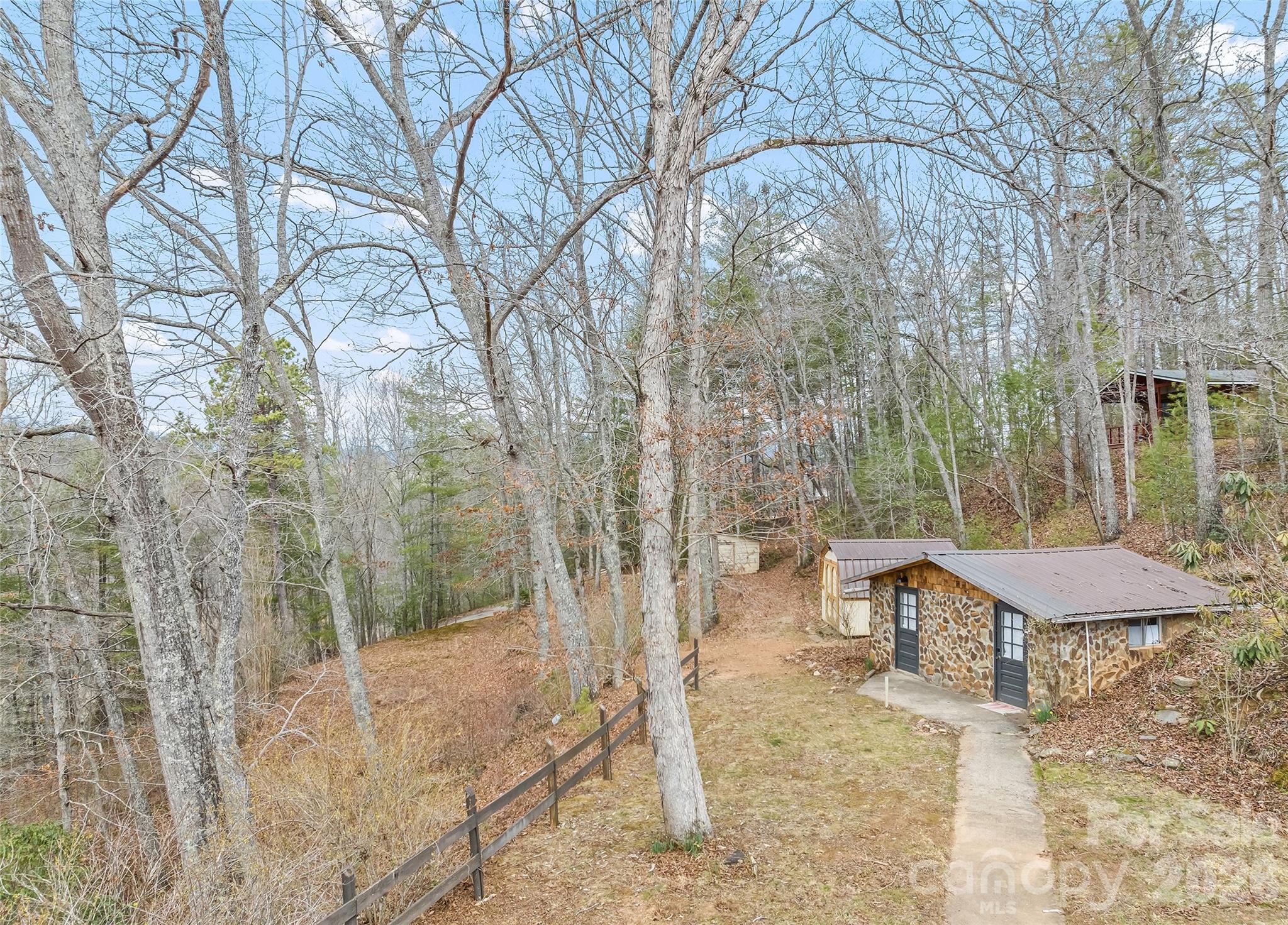 171 Fortner Road Bryson City, NC 28713 - Photo 25 of 32 a view of a chairs and table in the backyard
