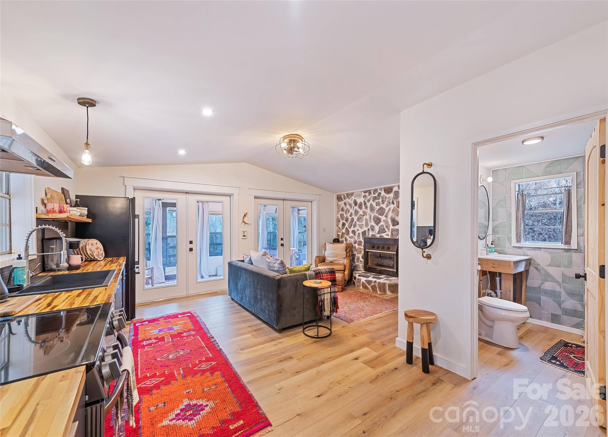 171 Fortner Road Bryson City, NC 28713 - Photo 4 of 32 a living room with fireplace furniture and a wooden floor