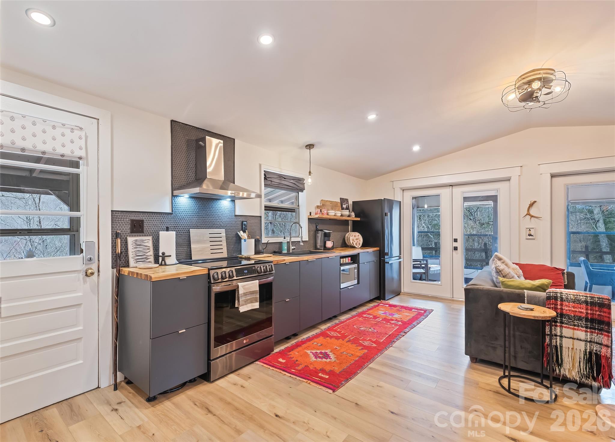 171 Fortner Road Bryson City, NC 28713 - Photo 8 of 32 a large kitchen with stainless steel appliances granite countertop a stove and a refrigerator