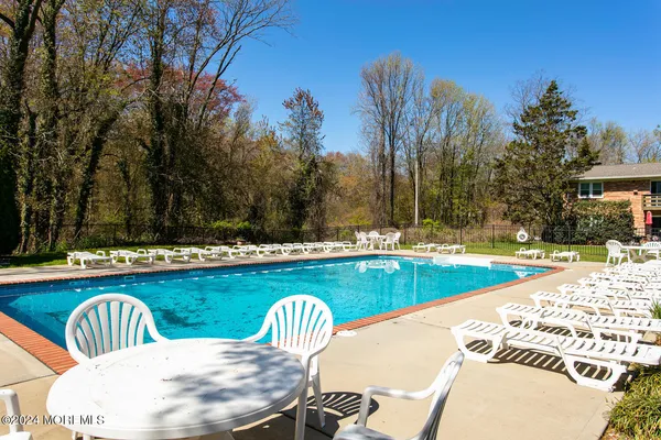 a view of a swimming pool with a lounge chairs