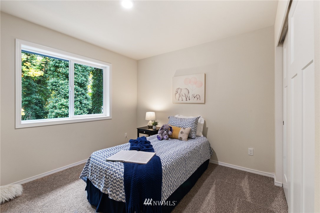17839 Southeast 128th Street Renton, WA 98059 - Photo 17 of 35 a bedroom with a bed and window