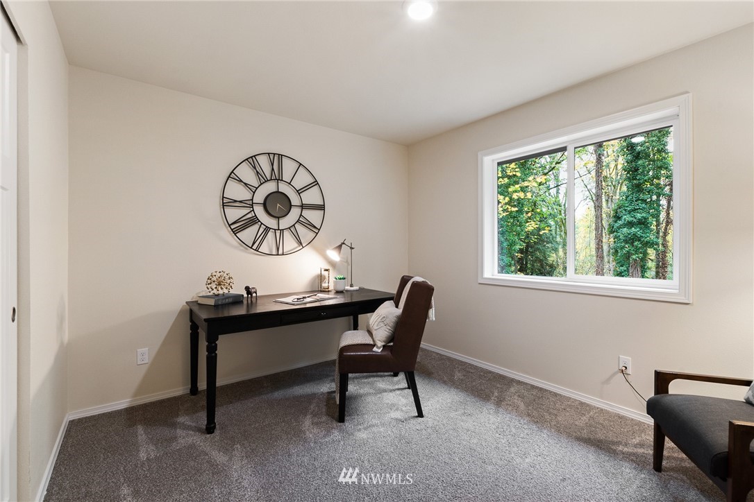 17839 Southeast 128th Street Renton, WA 98059 - Photo 19 of 35 a view of a workspace with a window and chair