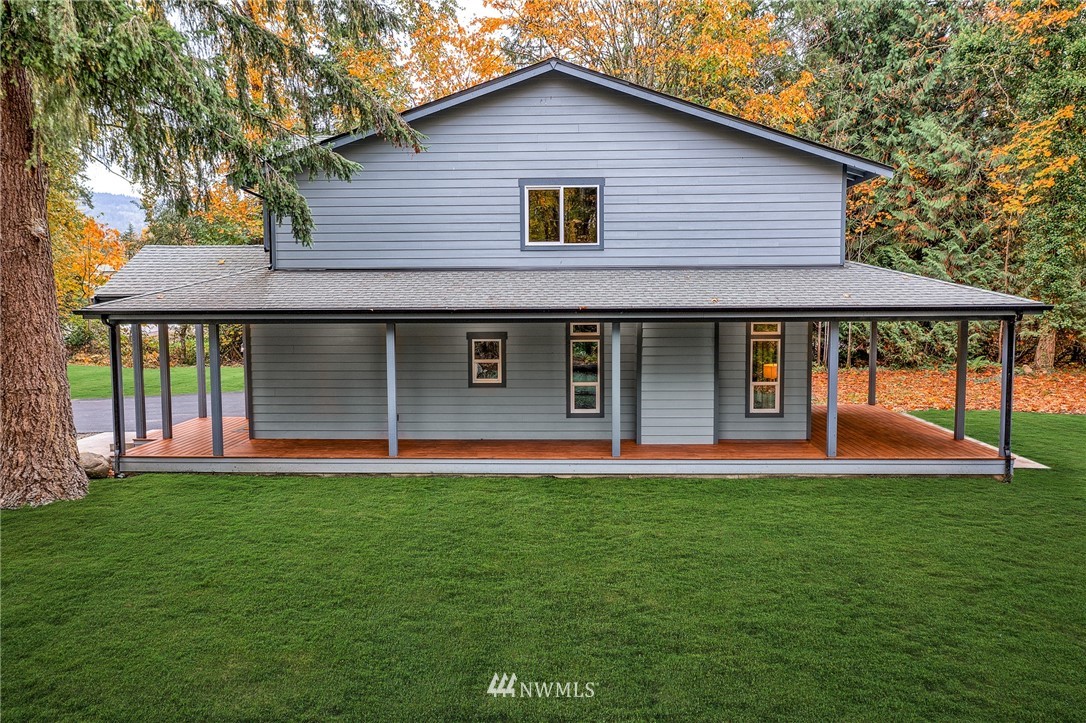 17839 Southeast 128th Street Renton, WA 98059 - Photo 25 of 35 a front view of a house with a yard and garage