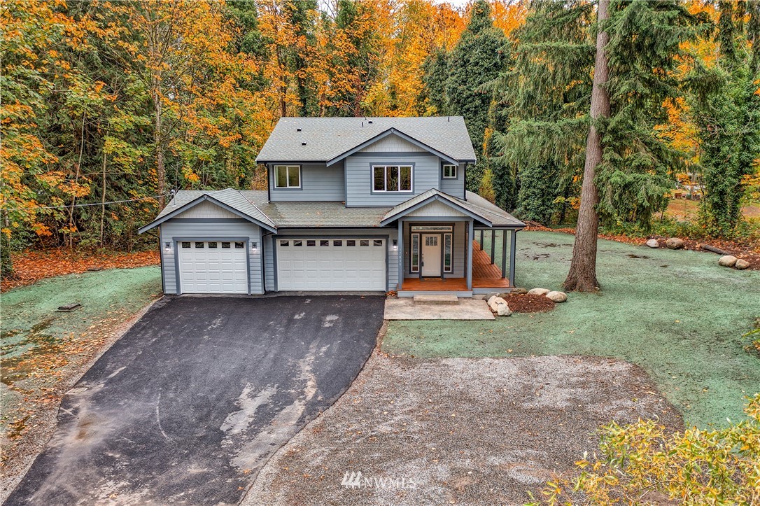 17839 Southeast 128th Street Renton, WA 98059 - Photo 31 of 35 a view of a house with a yard and large tree