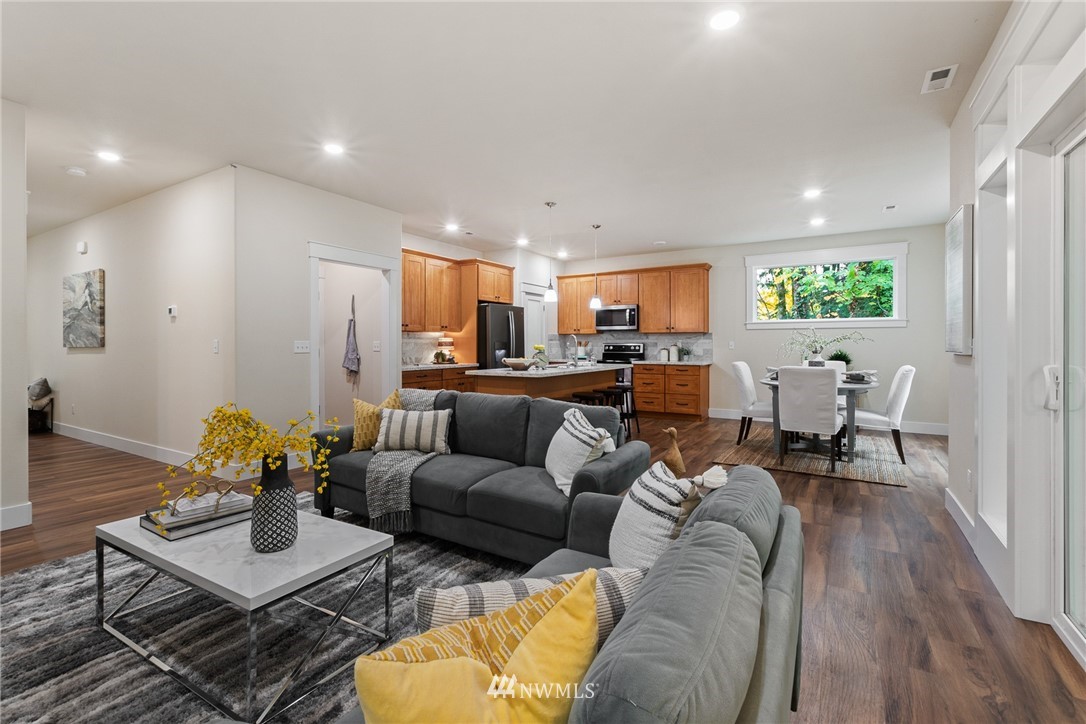 17839 Southeast 128th Street Renton, WA 98059 - Photo 4 of 35 a living room with furniture and a wooden floor