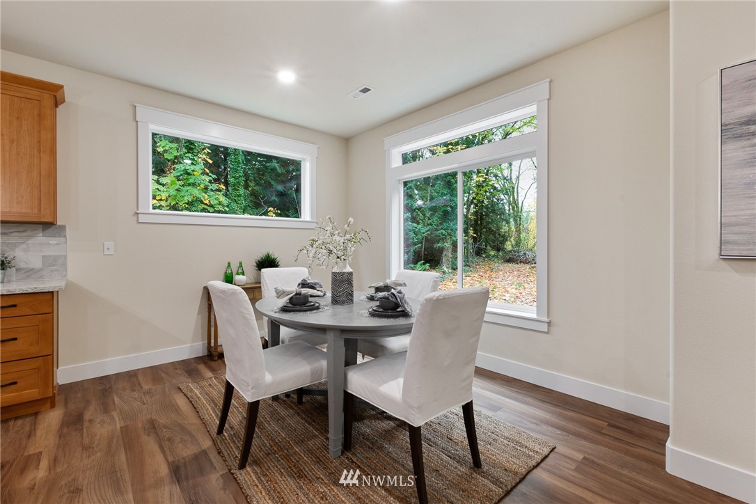 17839 Southeast 128th Street Renton, WA 98059 - Photo 9 of 35 a view of a dining room with furniture window and outside view