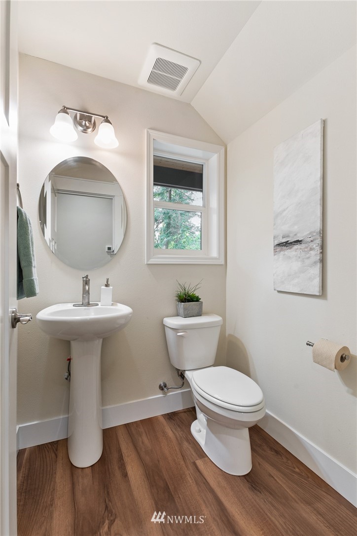 17839 Southeast 128th Street Renton, WA 98059 - Photo 10 of 35 a bathroom with a toilet sink and mirror