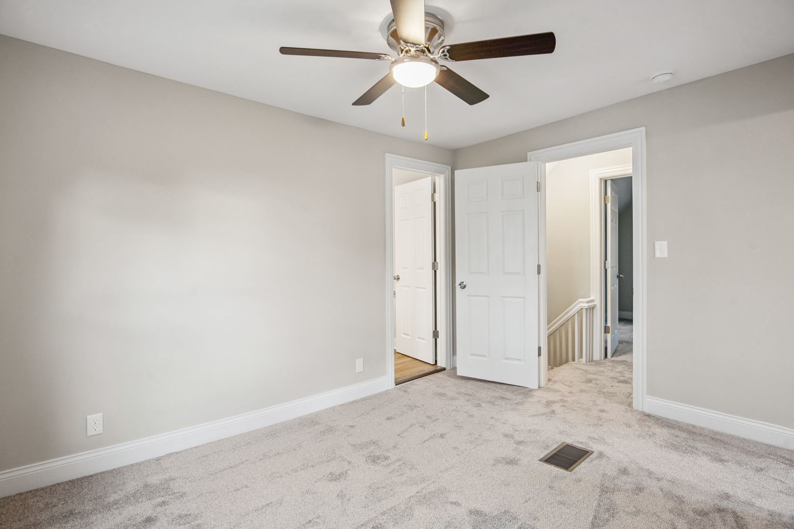 1424 Clark Street DeKalb, IL 60115 - Photo 19 of 23 an empty room with closet and fan