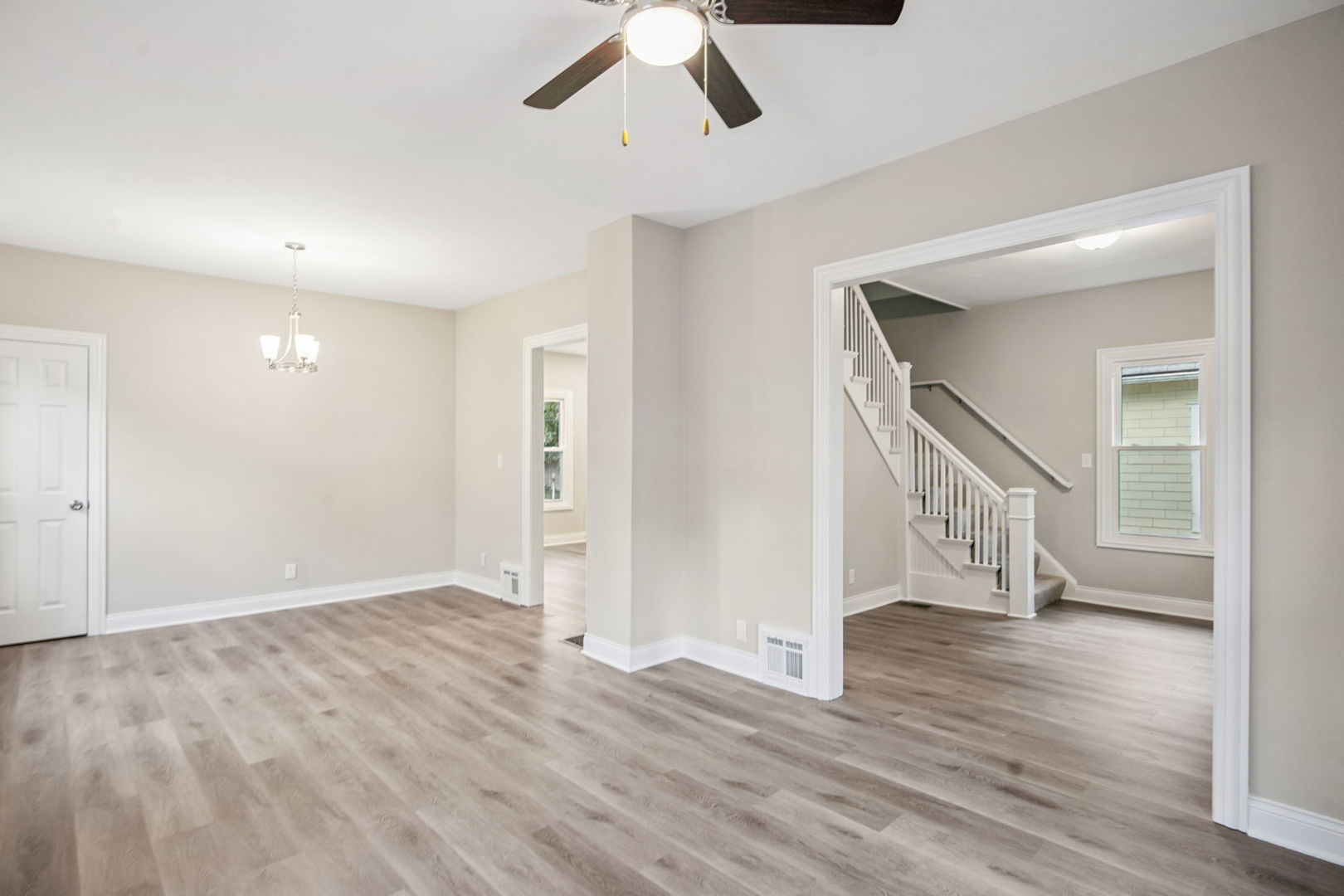 1424 Clark Street DeKalb, IL 60115 - Photo 9 of 23 a view of an empty room with wooden floor and entryway