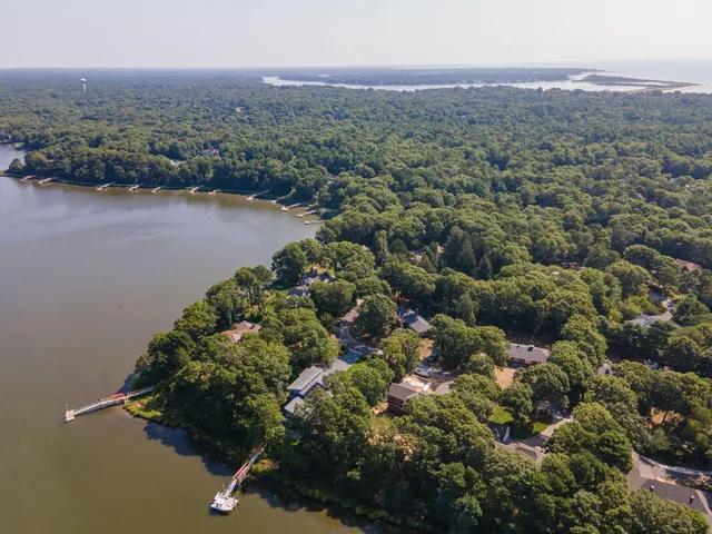 an aerial view of a town with trees