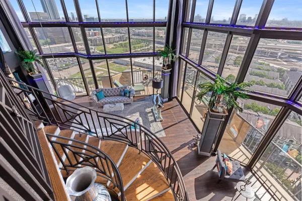 a bedroom with bed and a flat tv screen on a dresser