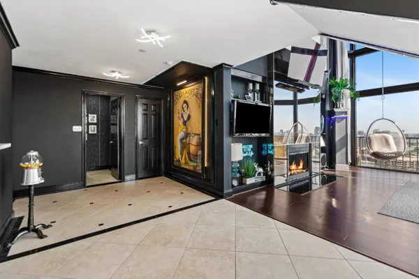 a lobby with a couch and a flat screen tv