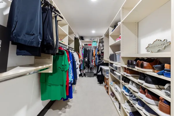 a bedroom with a large bed and a large window