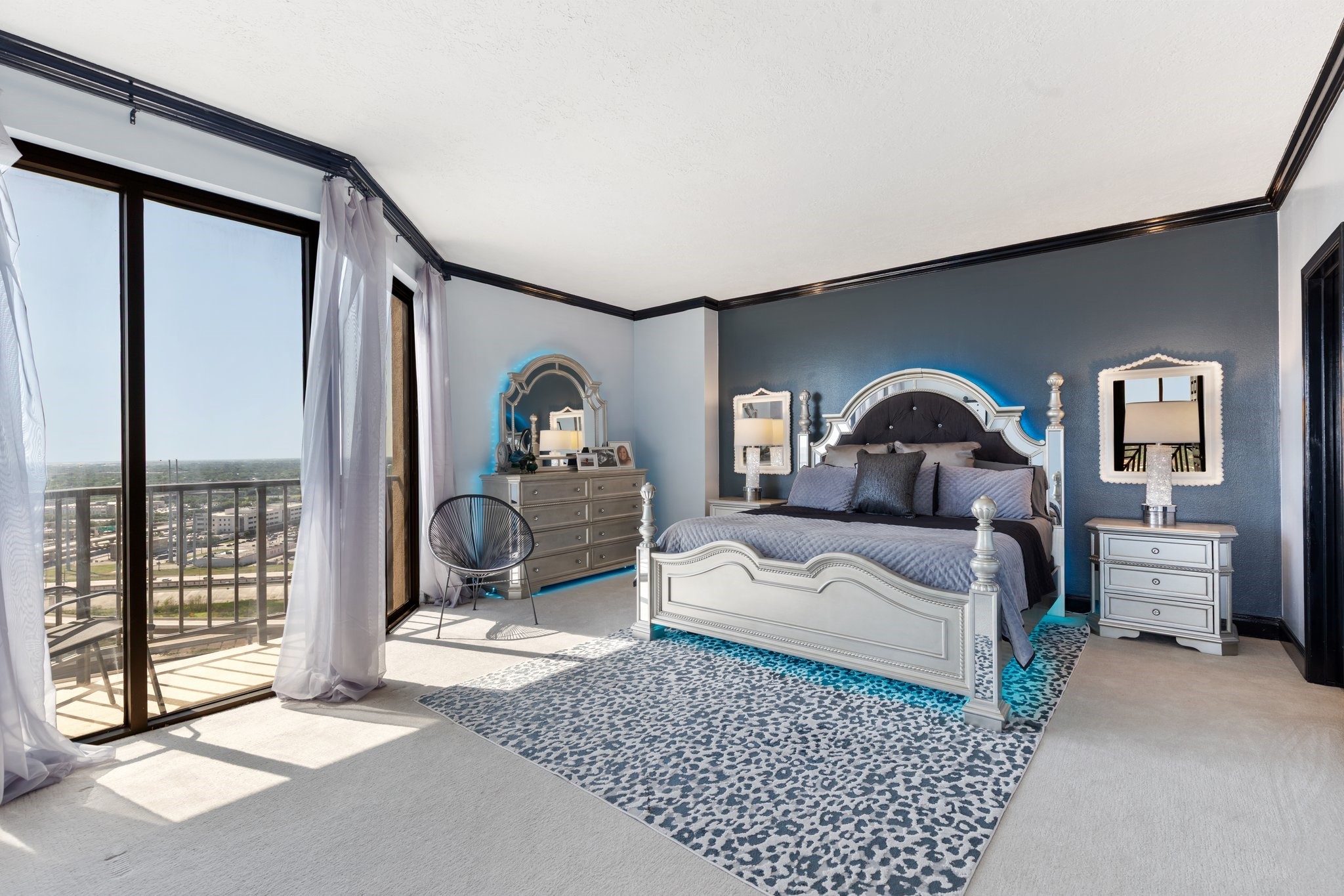 3350 McCue Road, Unit 2404 Houston, TX 77056 - Photo 36 of 49 a bedroom with a large bed and a large window