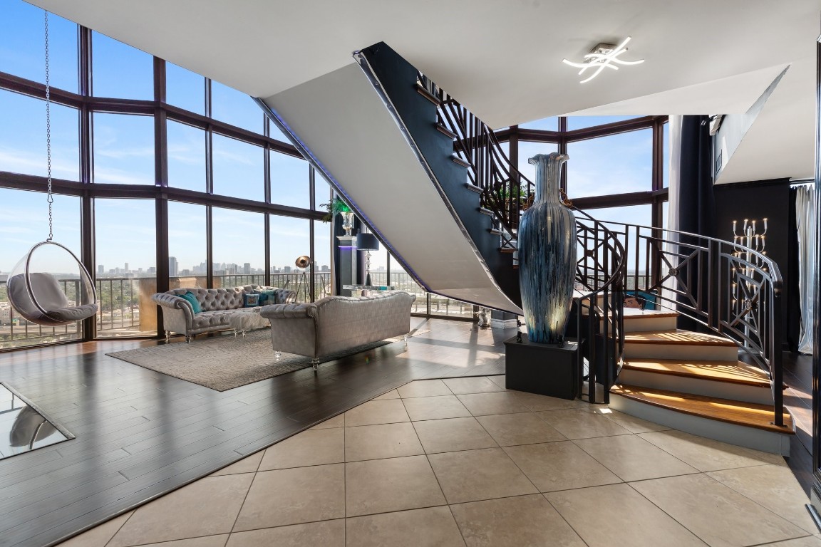 3350 McCue Road, Unit 2404 Houston, TX 77056 - Photo 4 of 49 a lobby with furniture and a floor to ceiling window